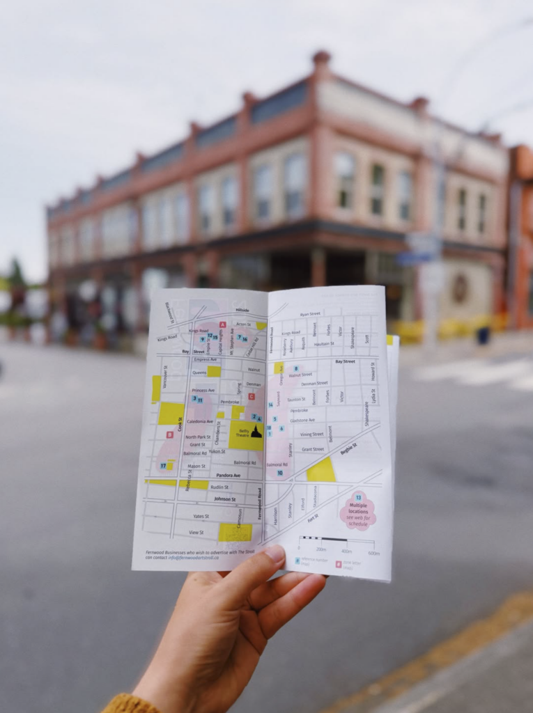 somebody holding up the map at the Fernwood Art Stroll